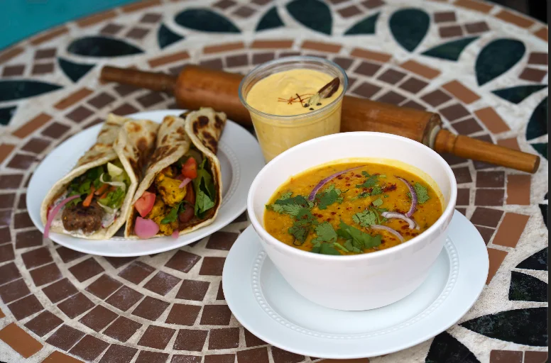 Refreshing mango lassi drink with cardamom