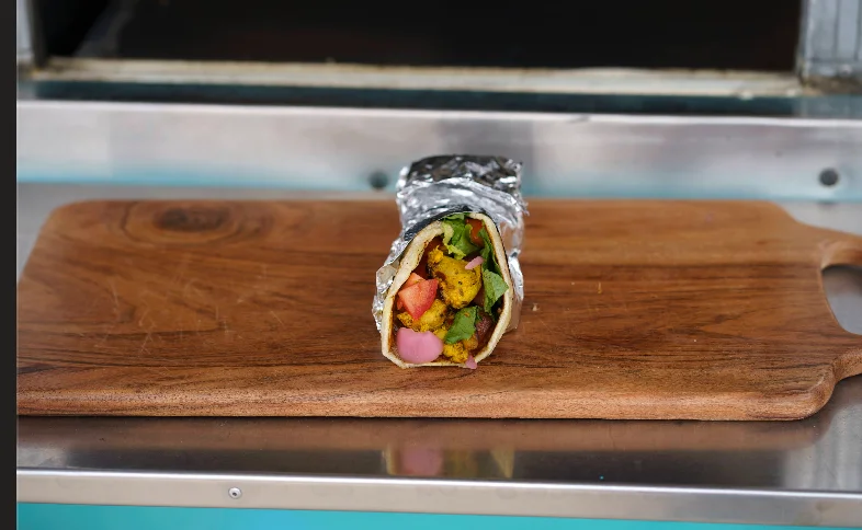 Chicken Tikka Roll with charred chicken and fresh toppings