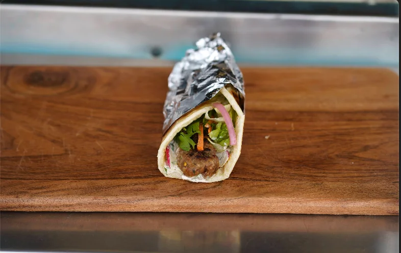 Kebab Roll wrapped in paratha with fresh vegetables